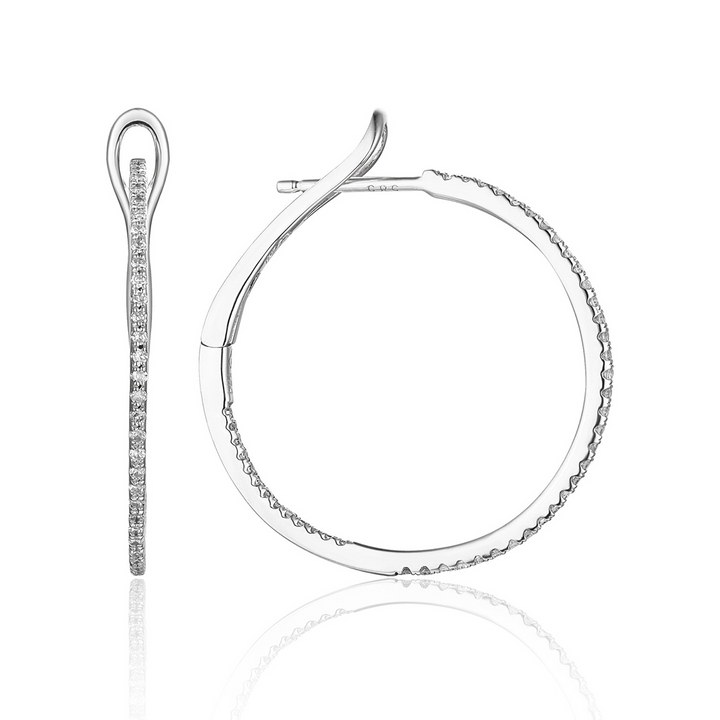 A pair of hoop earrings with a single row of round diamonds. The right earring is angled to the side.