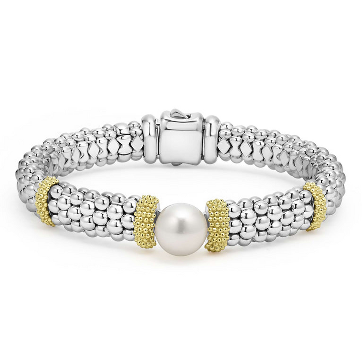 A sterling silver & 18k gold bracelet displayed in the middle of a white background featuring a freshwater cultured pearl, smooth sterling silver, Caviar beading, and 18K gold stations.