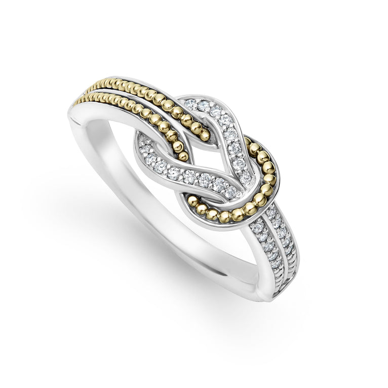 A Sterling Silver & 18K Gold ring angled in the middle of a white background, featuring diamonds and 18K gold woven in a knot motif 