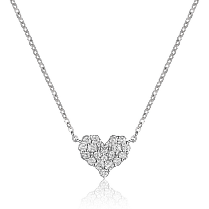 A close-up of a white-gold Diamond Cluster Heart Necklace against a white background. The necklace features a heart design with a cluster of round diamonds.