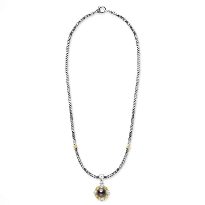 A sterling silver & 18k gold necklace featuring a Tahitian black pearl circle pendant and caviar beading against a white background and showing the clasp at the top against a white background.