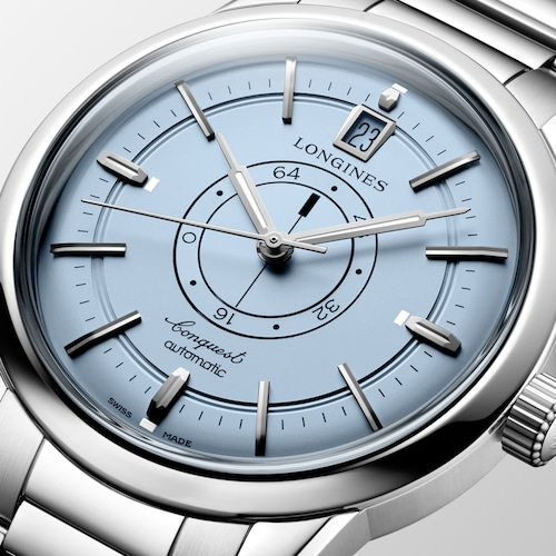 Close up view of the front of a LONGINES L1.648.4.92.6 with a light blue dial