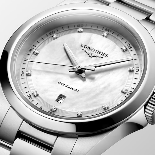 Close up view of the front of a LONGINES L3.350.4.87.6 with a mother of pearl dial