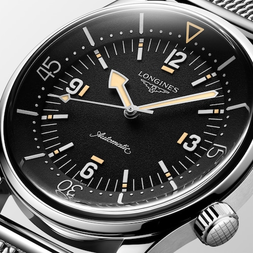 Close up view of the dial of a LONGINES L3.795.4.59.9 with a black dial
