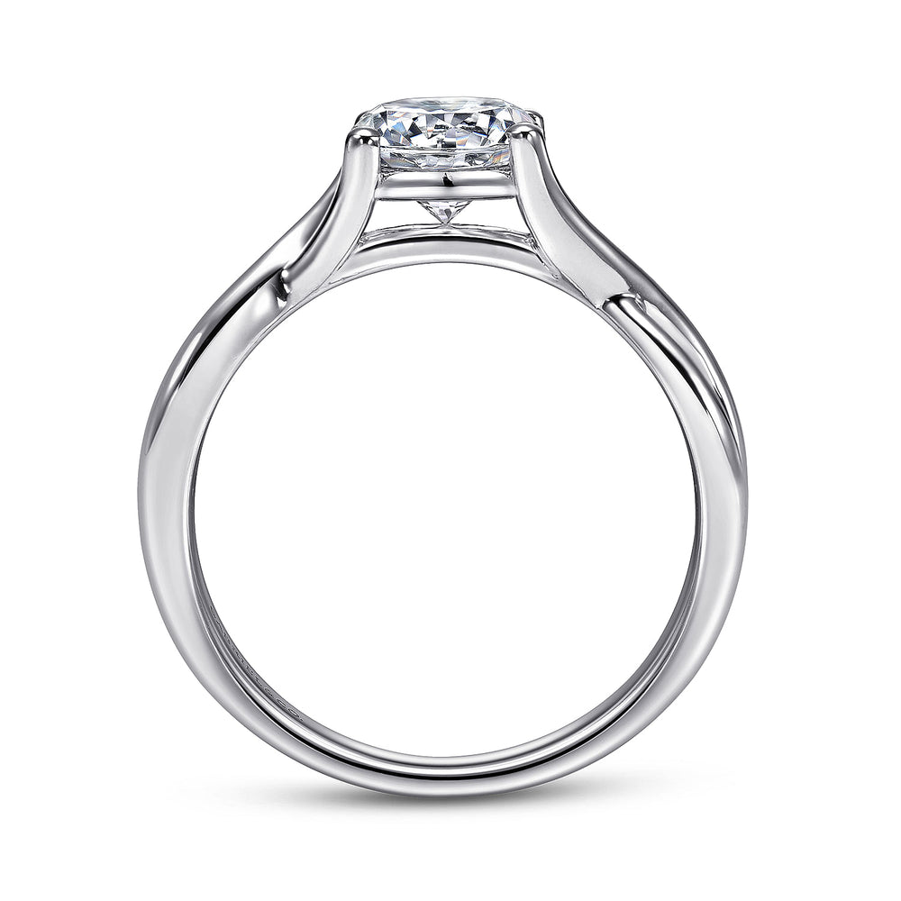 Side view of a white gold twisted engagement ring showing the raised center setting and curved band details.