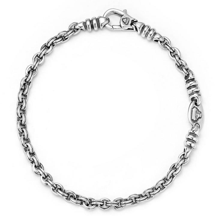 A sterling silver link bracelet in the middle of a white background featuring Sterling silver fluted links