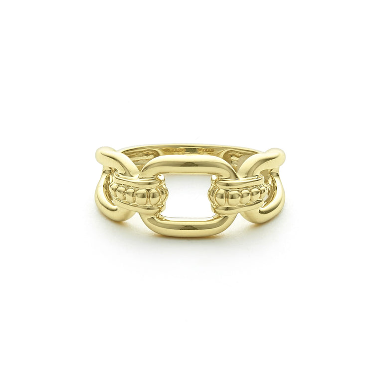 An 18K gold oval link ring in the middle of a white background features caviar beading and fluting elements.