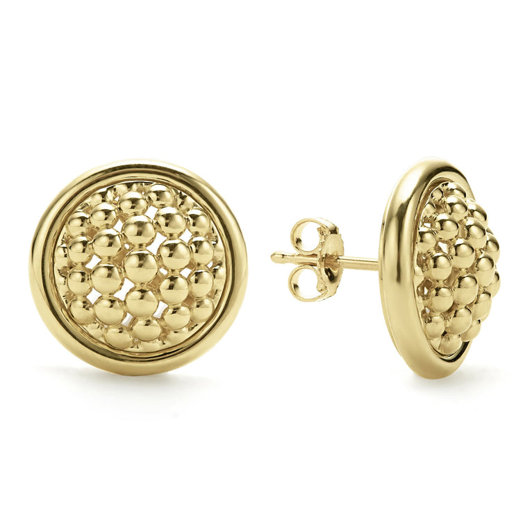 18k gold Caviar beading surrounded by gold ceramic detailing form on the studs earrings. The stud on the right is angled showing the back.