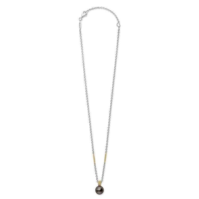 A sterling silver & 18k gold necklace featuring a tahitian black pearl against a white background and showing the clasp at the top.