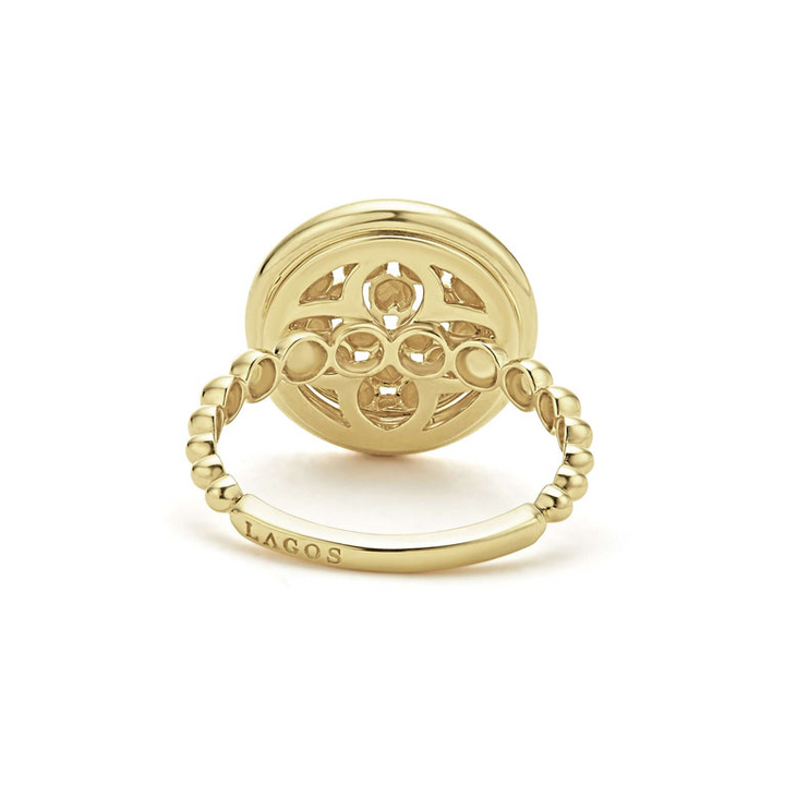 A back-view of An 18K Gold ring in the middle of a white background featuring caviar beading and smooth gold detailing.