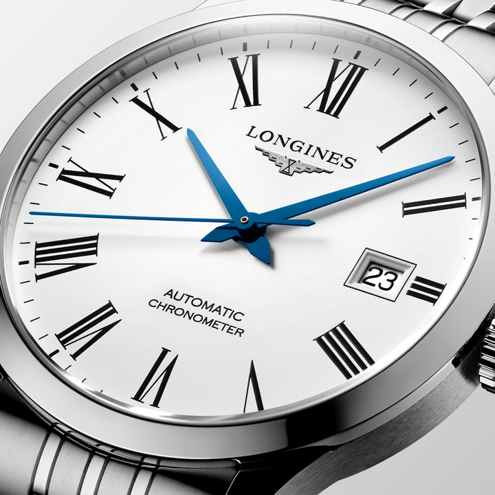 A close-up of a Longines watch highlighting the white dial and crown. 