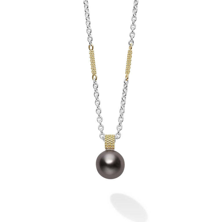 This is a close-up of a sterling silver & 18k gold necklace featuring a tahitian black pearl against a white background.