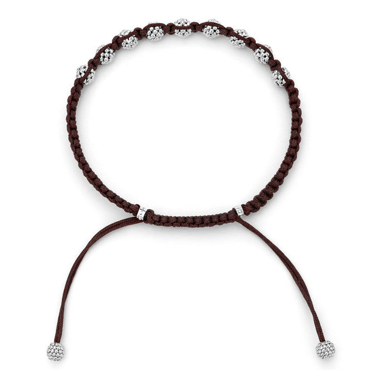 A side-view of a brown bracelet in the middle of the white background featuring a braided nylon with sterling silver Caviar beads.