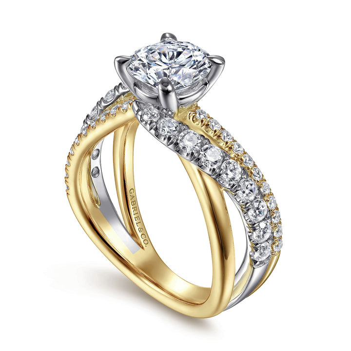 A close-up of a ring made of yellow gold, angled to the left against a white background. It features a round-cut diamond set in the center with a twisted design diamond set band.