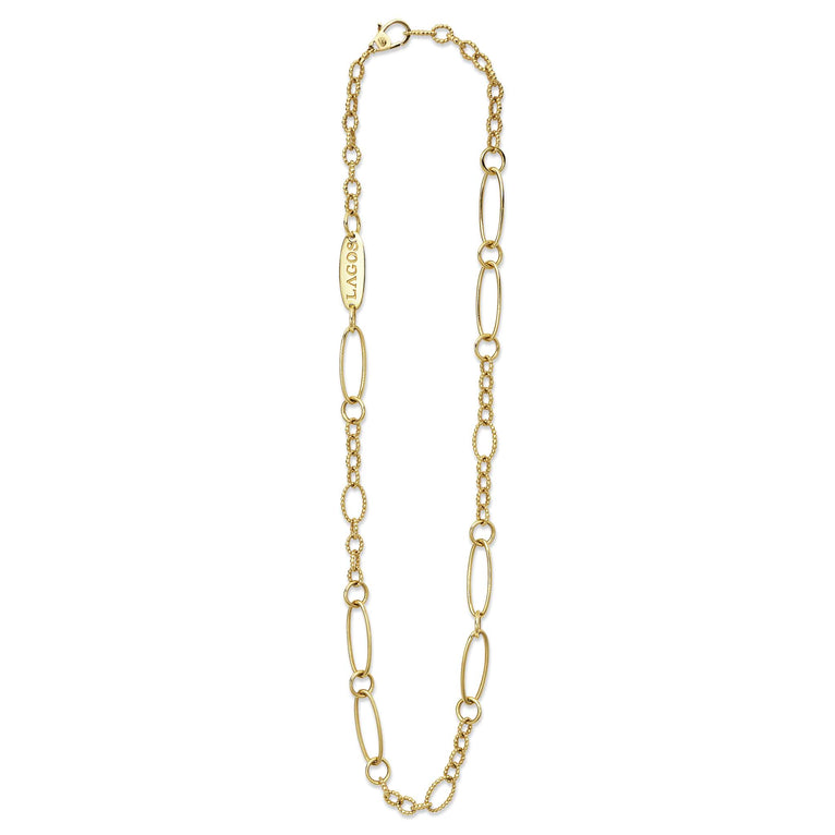 A18k gold link necklace featuring caviar beading and fluting elements showing the clasp at the top against a white background.