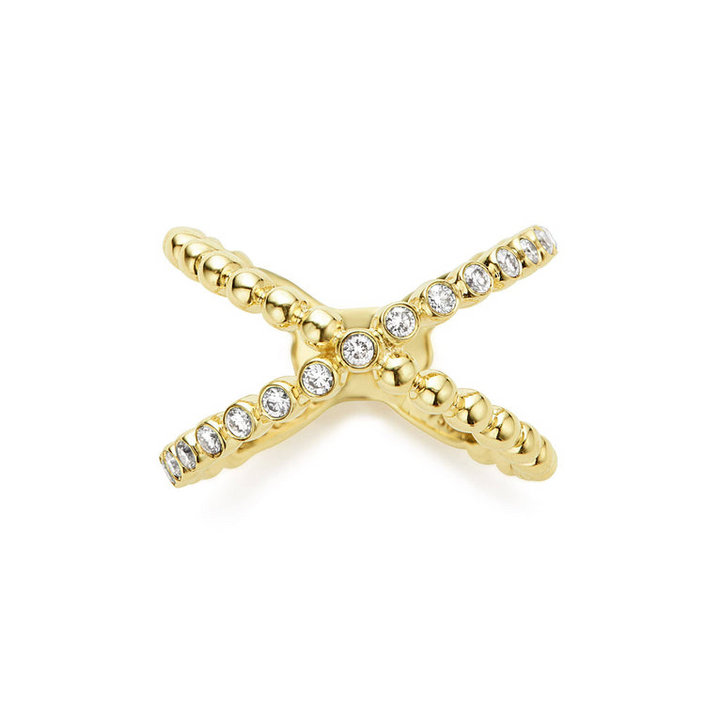 An 18K Gold ring laid flat against a white background featuring caviar beading and an X design.