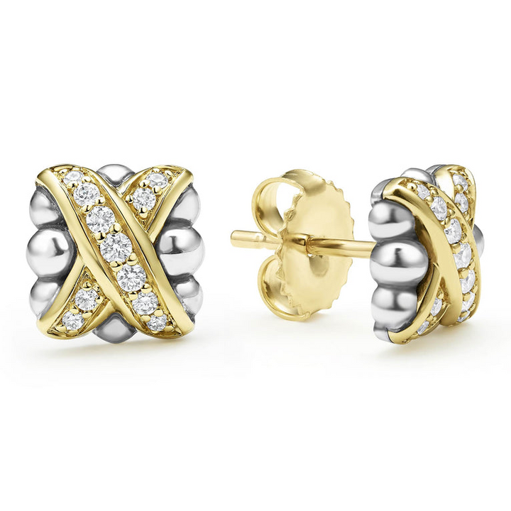 A pair of two-tone stud earrings with 18K gold and diamonds surrounded by sterling silver and an x motif. The right earring is angled to the side, showing the back.