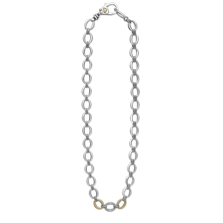 A sterling silver &18k gold necklace featuring a pave diamond link, caviar beading, and a lobster clasp. against a white background and showing the clasp at the top against a white background.