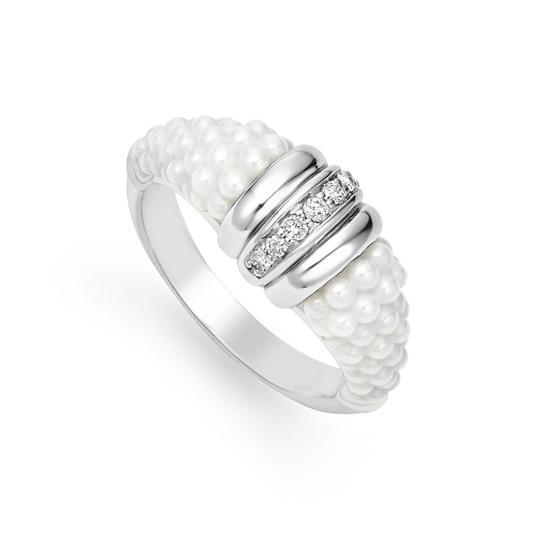 A sterling silver ring is displayed angled on a white background featuring white ceramic caviar beading with a row of diamonds.