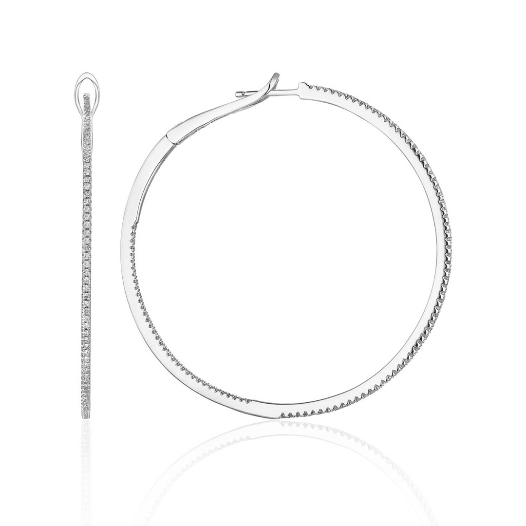 A pair of hoop earrings with a single row of round diamonds. The right earring is angled to the side.