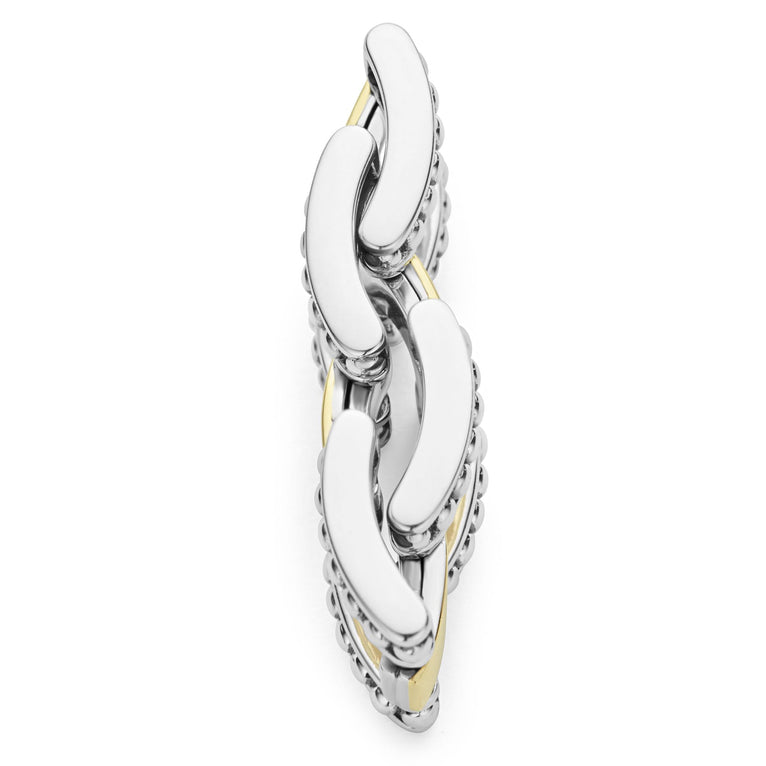 A side-view of sterling silver and 18k gold ring displayed in the middle of a white background featuring smooth stations of 18K gold set by sterling silver Caviar beading