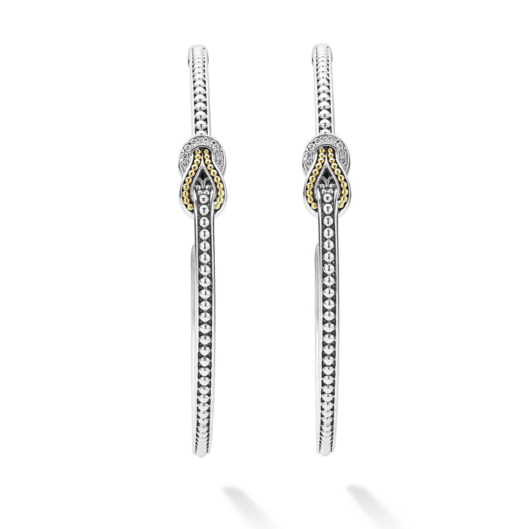 A pair of hoop earrings with diamonds and 18K gold woven in a knot motif. 