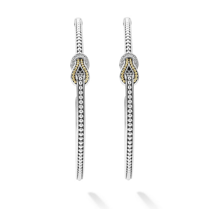 A pair of hoop earrings with diamonds and 18K gold woven in a knot motif. 