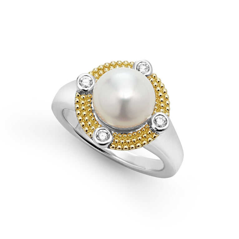 A sterling silver and 18k gold ring displayed angled in the middle of a white background featuring a freshwater cultured pearl surrounded by sterling silver, diamonds, and 18K gold