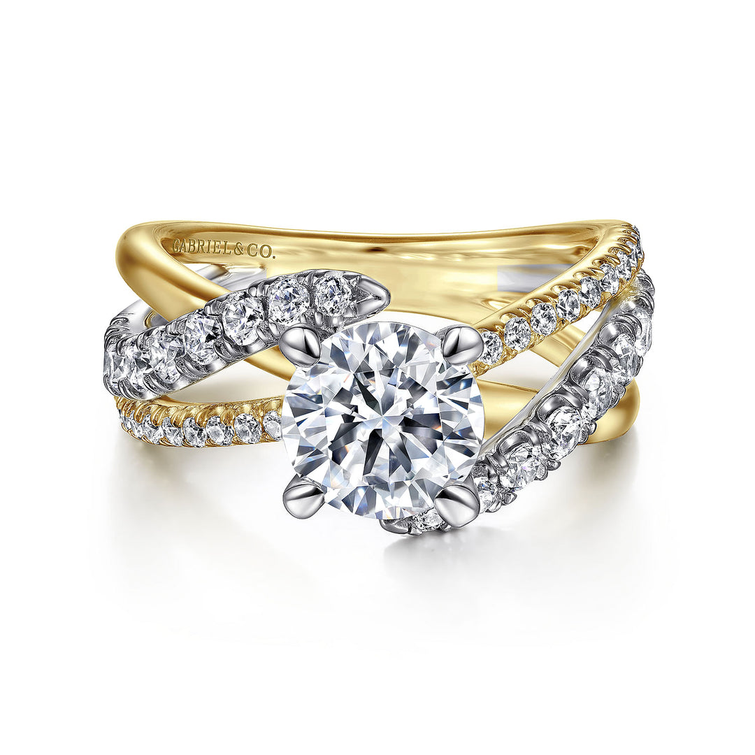 A yellow-gold ring lies flat against a white background. It features a round-cut diamond set in the center with a twisted design diamond set band.