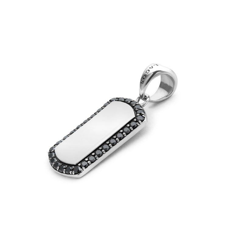 A sterling silver amulet displayed angled in the middle of a white background featuring black diamonds accented by smooth silver and Caviar beading