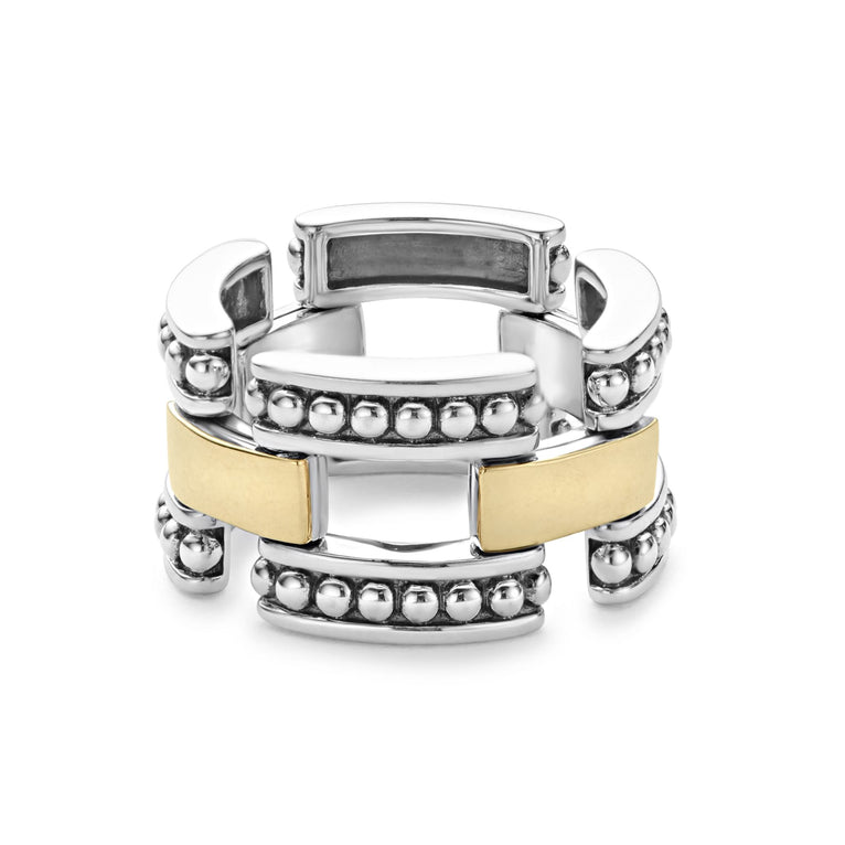 A sterling silver and 18k gold ring displayed in the middle of a white background featuring smooth stations of 18K gold set by sterling silver Caviar beading