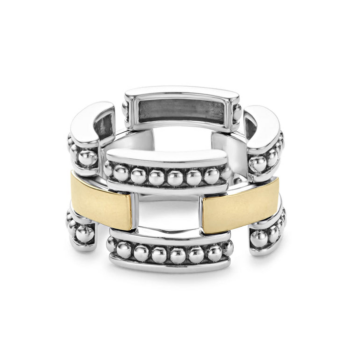 A sterling silver and 18k gold ring displayed in the middle of a white background featuring smooth stations of 18K gold set by sterling silver Caviar beading