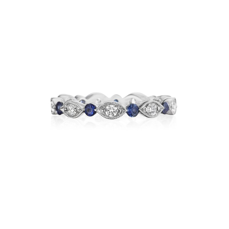 A front view of a white gold wedding band against a white background. The ring features an alternating prong-set round diamonds, surrounded by intricate marquise detailing, and a sapphire round center stone.
