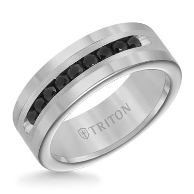 An angled view of a white gold wedding band against a white background. The ring features a classic band with the bold sophistication of black diamonds.
