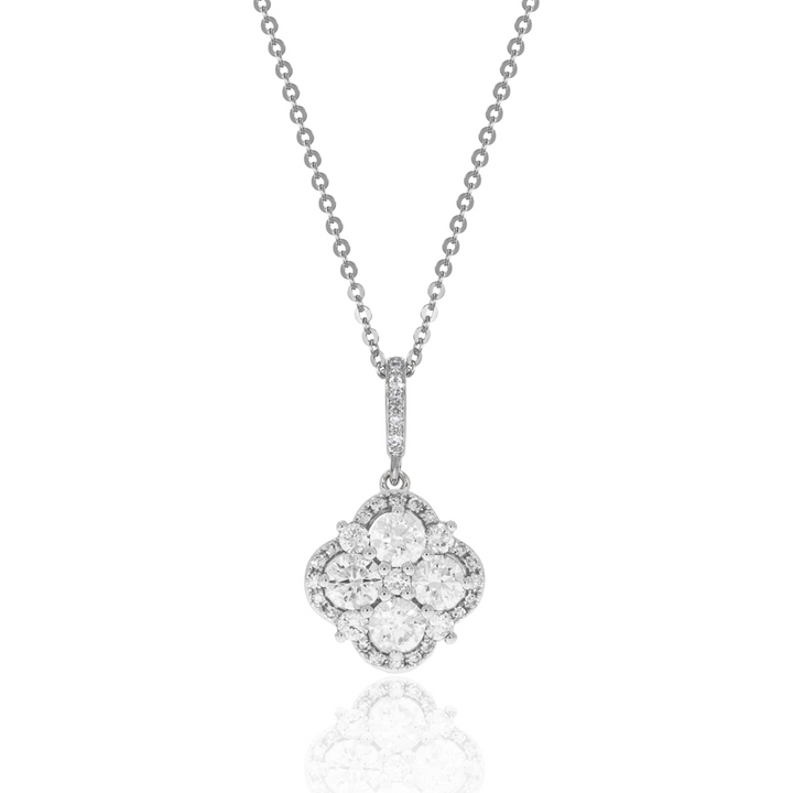 A close-up of a white-gold Halo Clover Necklace against a white background. The necklace features a clover motif pendant with round diamonds, milgrain detailing, and a 14k white gold chain.