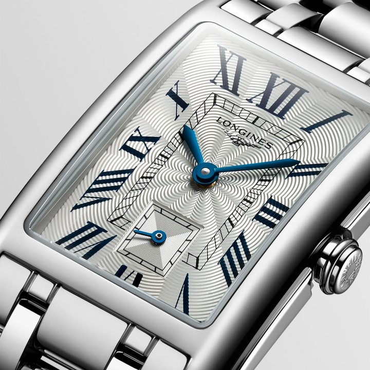 This is a close-up of a Longies watch angled to the right, showcasing the dial with a white background. The rectangular-shaped watch features a white dial, blue hands, black markers, a stainless steel bezel, and a stainless steel bracelet.