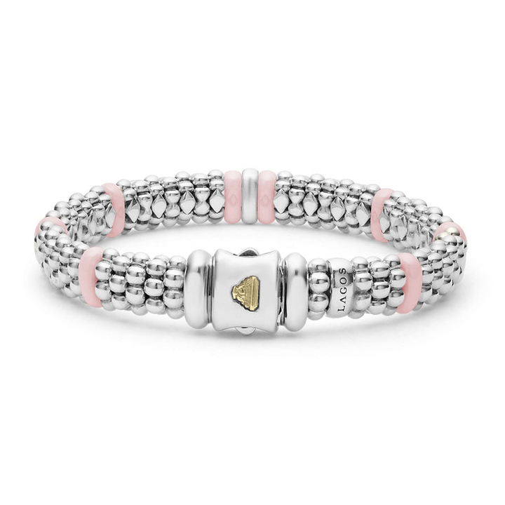 A back view of sterling silver & 18k gold bracelet displayed in the middle of a white background, featuring pink ceramic and Caviar beading.