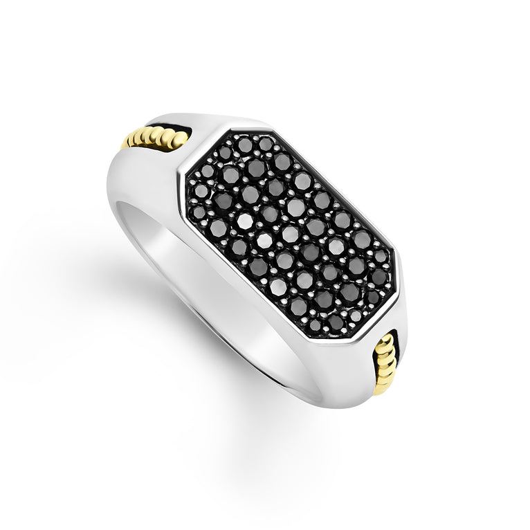 A Sterling Silver & 18K Gold ring angled in the middle of a white background, featuring black diamonds accented by sterling silver and 18K gold Caviar beading