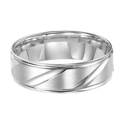 A front view of a platinum wedding band against a white background. The ring features angular carvings.