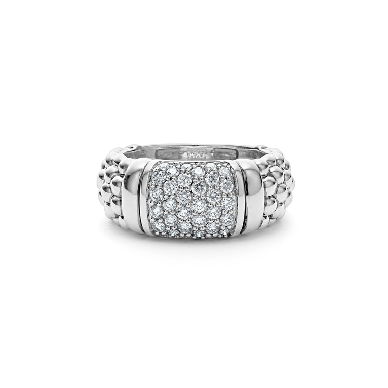 A white gold ring is in the middle of a white background. The ring features alternating designs of diamond-set and caviar beaded stations.