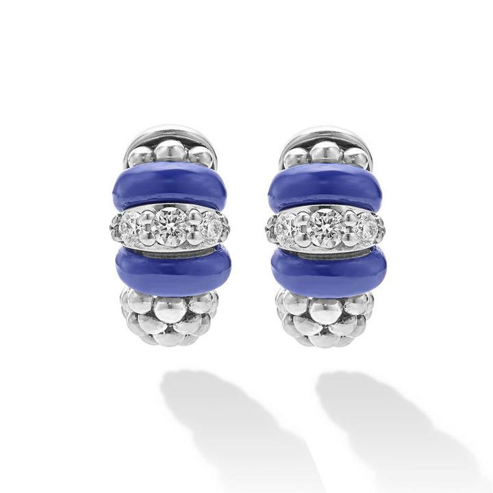 A pair of huggie earrings with smooth ultramarine ceramic and diamonds with Caviar beading.