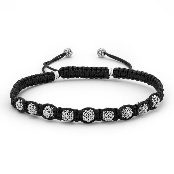 A black bracelet is in the middle of a white background, featuring braided nylon and silver Caviar beads.