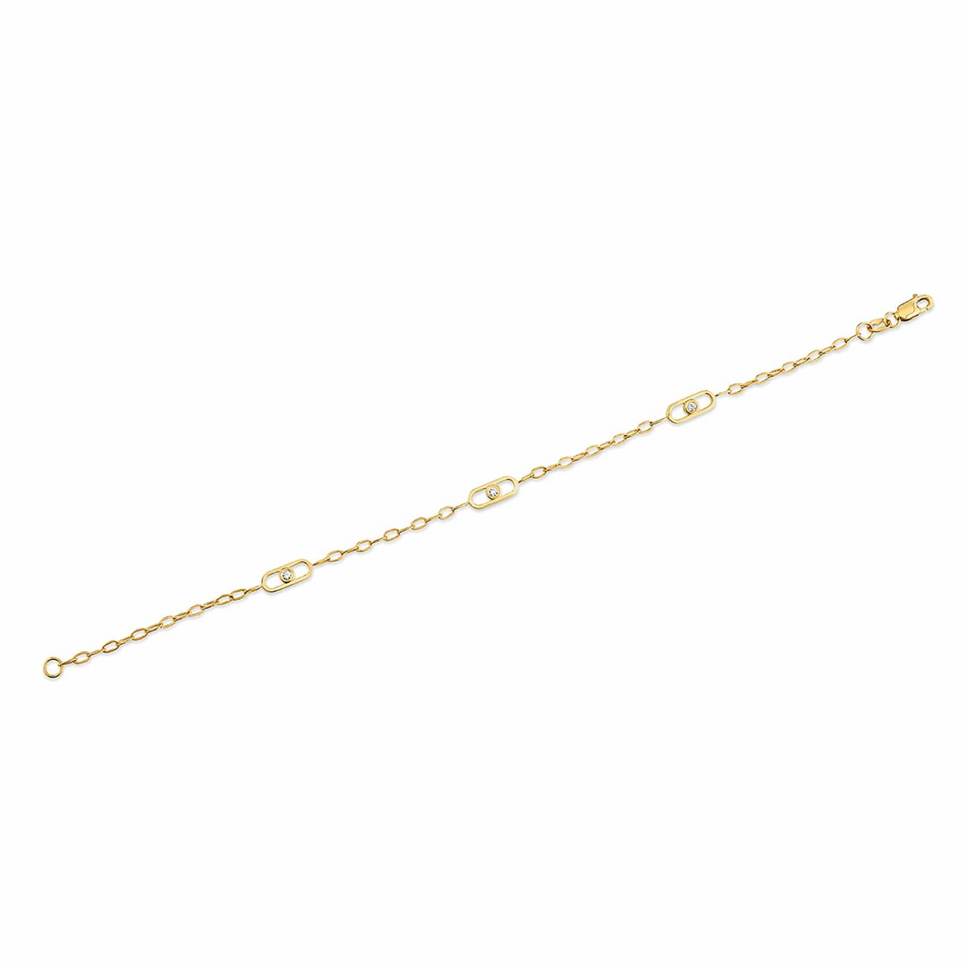 A yellow-gold bracelet lying flat across a white background. The station-style bracelet features a flat link with a bezel set diamond in the center.