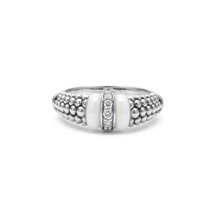 A front view of a white gold diamond ring against a white background. The ring features round-shaped diamonds set in sterling silver, accented by sleek white ceramic and Caviar beading around the band. 