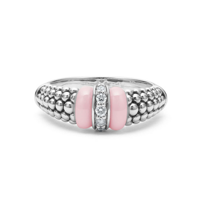 A front view of a white gold diamond ring against a white background. The ring features round-shaped diamonds set in sterling silver, accented by sleek light pink ceramic and Caviar beading around the band. 