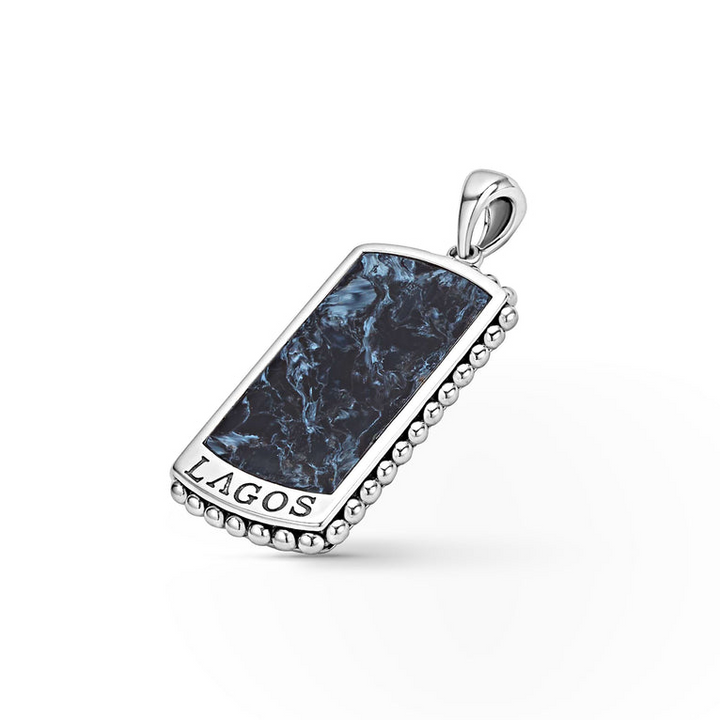 A Pietersite Tag Amulet featuring a Pietersite gemstone accented by sterling silver Caviar beading is 
displayed to the right in the middle of a white background