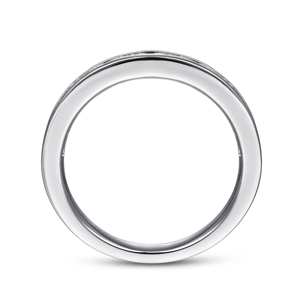 A side profile view of a white gold wedding band against a white background. The ring features a half eternity style with channel-set round diamonds.