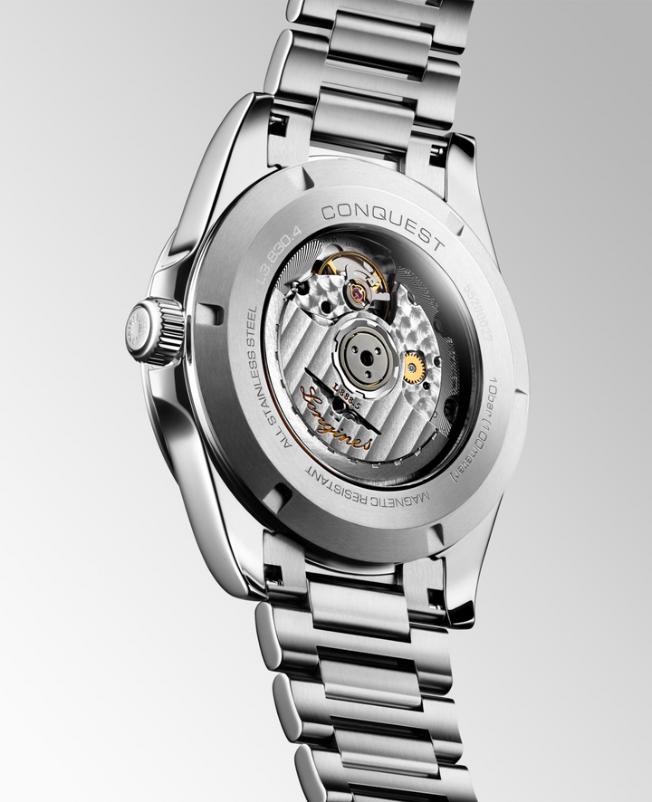 Close up view of the back of a LONGINES Conquest with a stainless-steel bracelet.