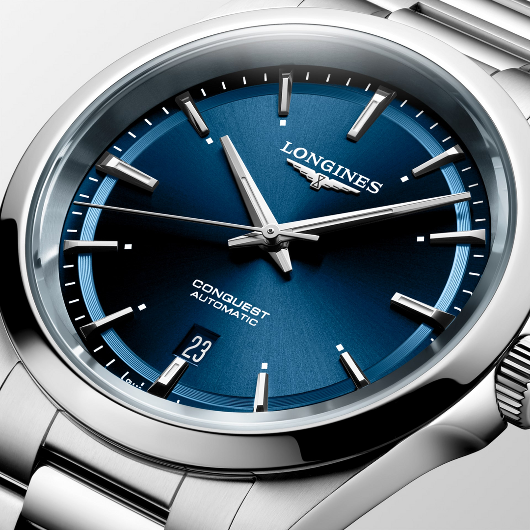 Close up view of LONGINES Conquest with stainless-steel bracelet, blue dial and a 41mm case.