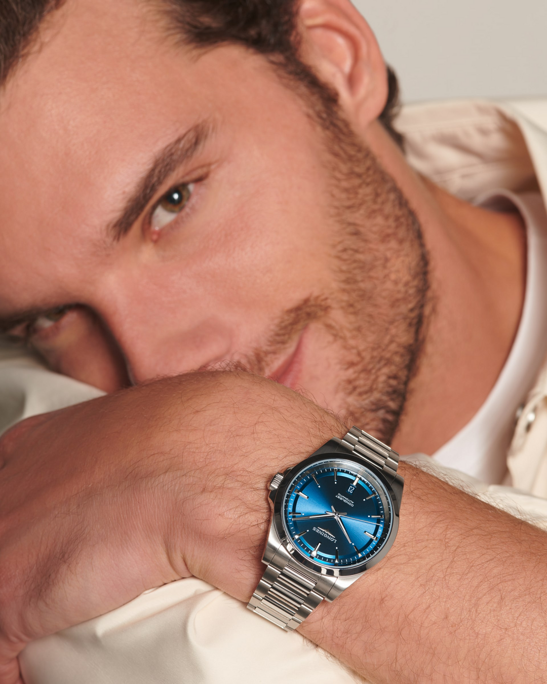 Close up of a man wearing a LONGINES Conquest with stainless-steel bracelet, blue dial and a 41mm case